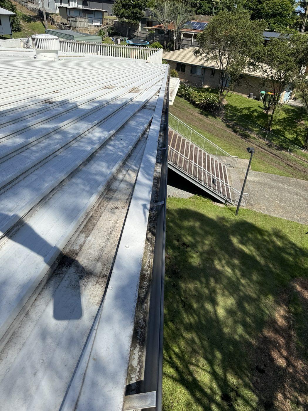 The same school walkway gutter cleaned out